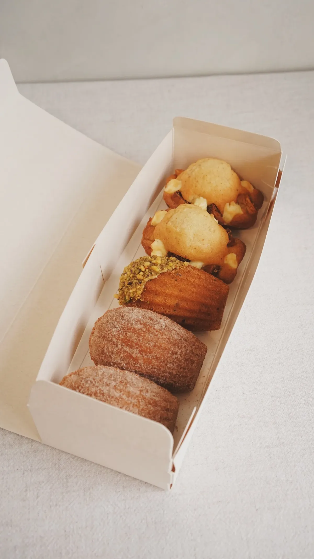 Open box showing madeleines and label